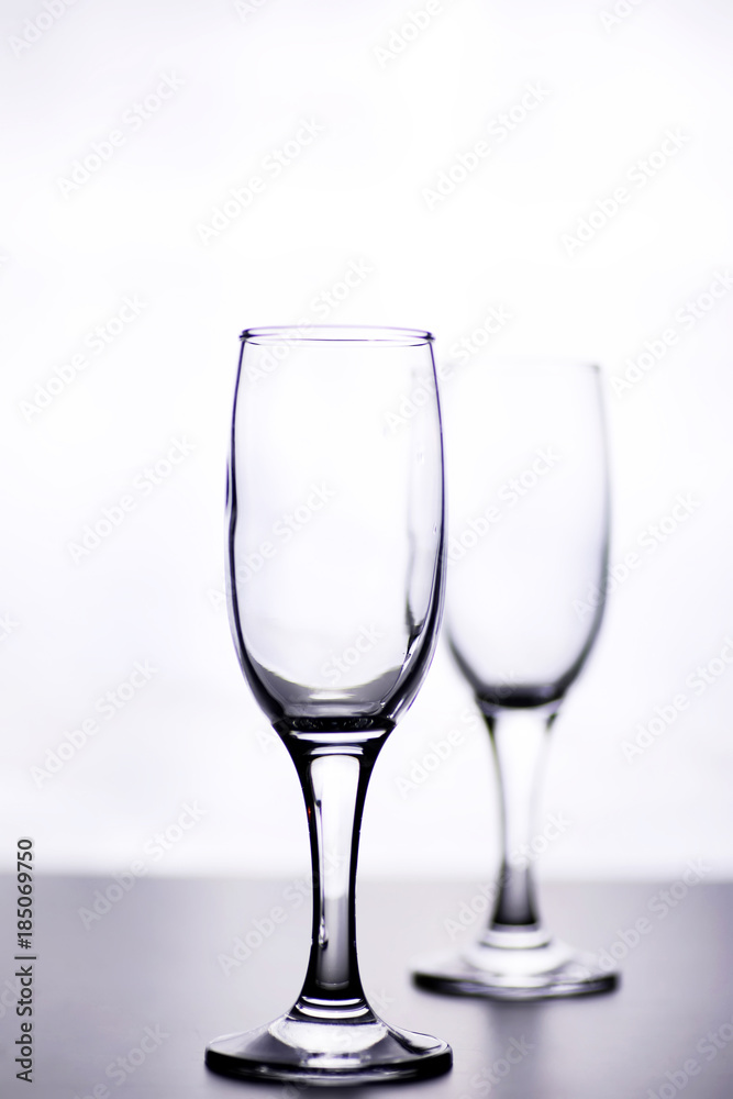 glass of white wine on a table on white background isolate