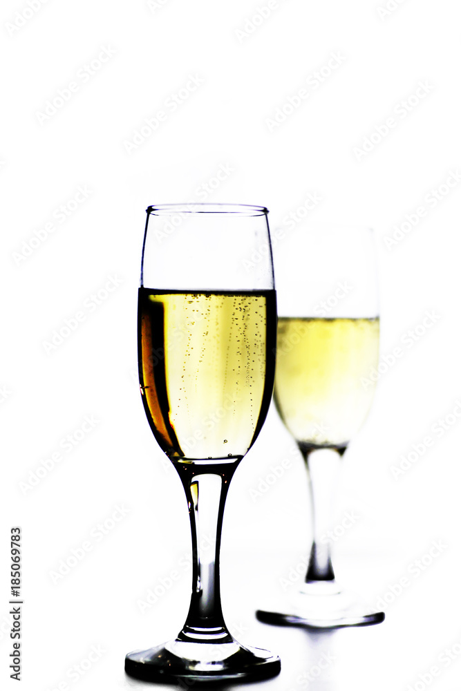 glass of white wine on a table on white background isolate