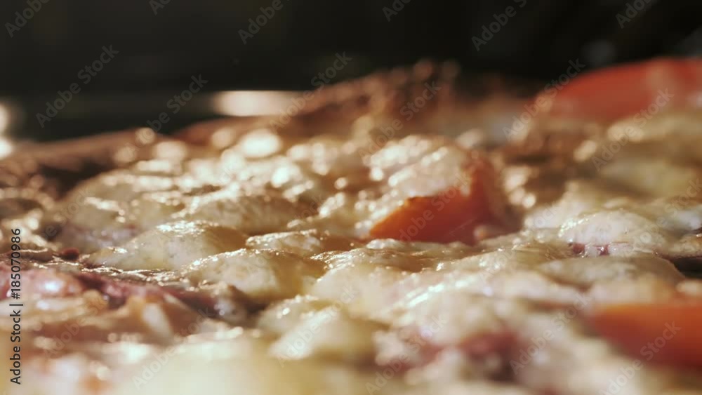 Cheese on pizza melts from oven heat