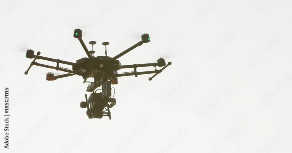 Large drone flying towards sunset - slow motion close up