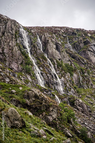 Waterfalls running down rock walls in Ireland. 