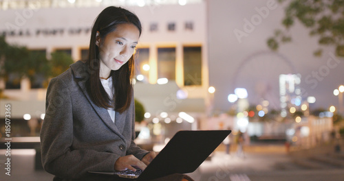 Photography Businesswoman use of laptop computer at night
