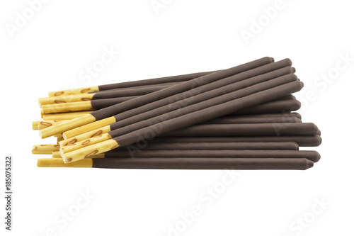 pile of biscuit sticks coated with chocolate isolated on white background