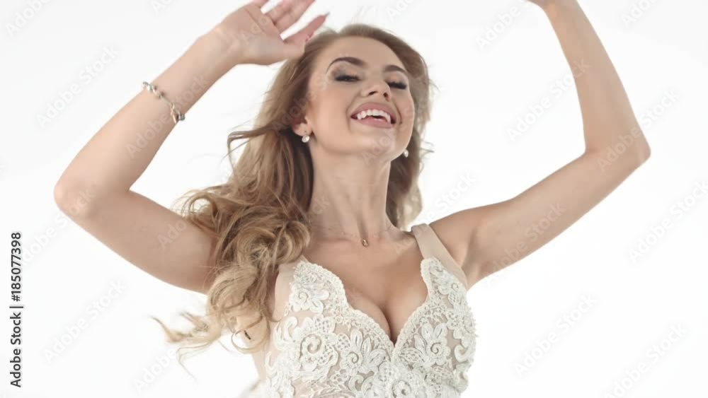 Attractive young blonde beauty posing on studio background Attractive young blonde beauty posing on studio background