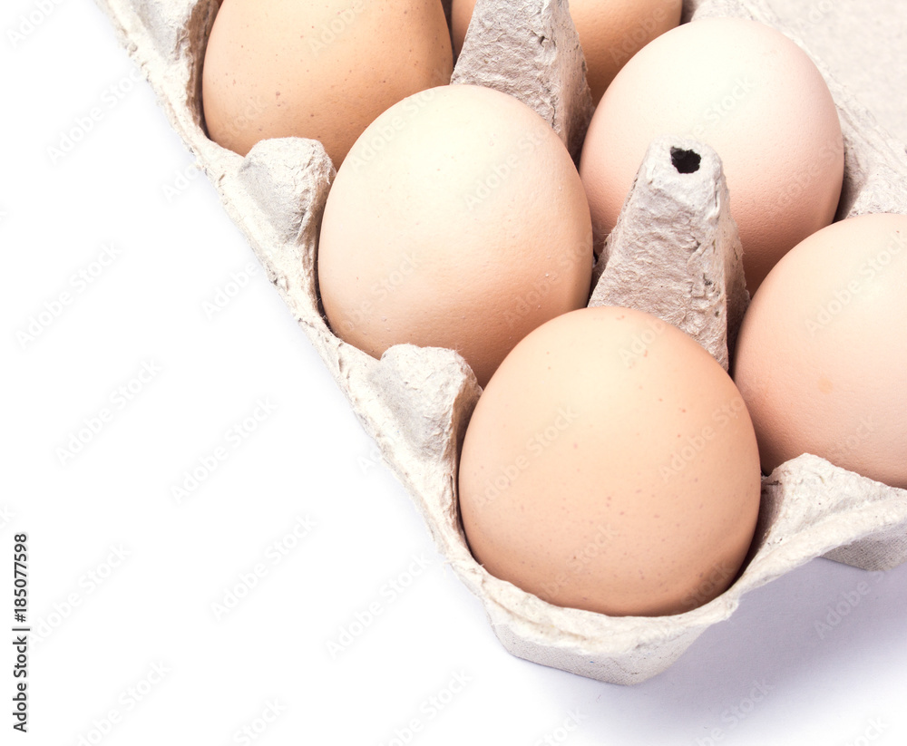 chicken eggs in a cardboard box isolated on white background chicken eggs in a cardboard box isolated on white background