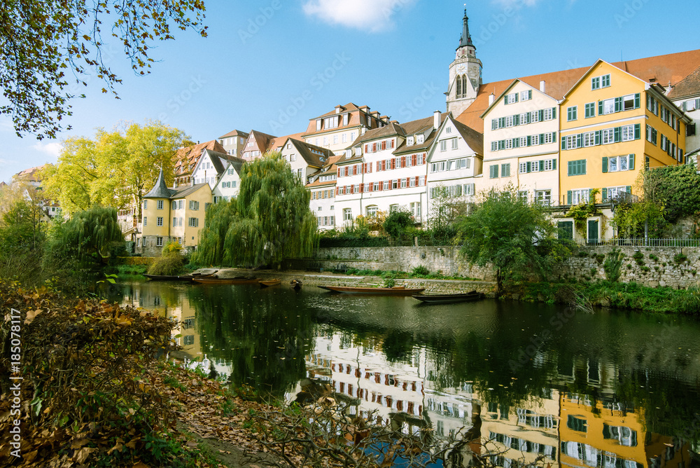 view of the river, walls and buildings of the historical part of the city of tübingen, in Germany