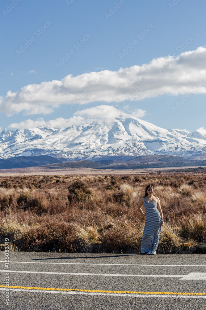 Ruapehu Mount, New Zealand, a woman standing at the side road