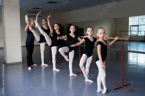 Children are taught ballet positions in choreography.