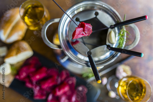 Traditional Swiss fondue with fresh beef meat.
