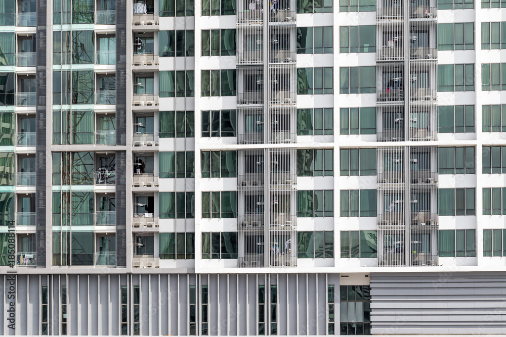 Apartment windows showing a new high rise condo with good real estate rentals and spaces to buy