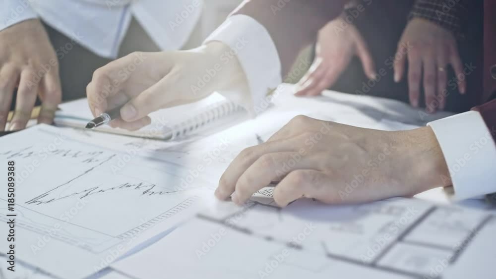Businesspeople collaborating on new plan Businesspeople collaborating on new plan