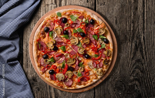Fresh pizza on wood