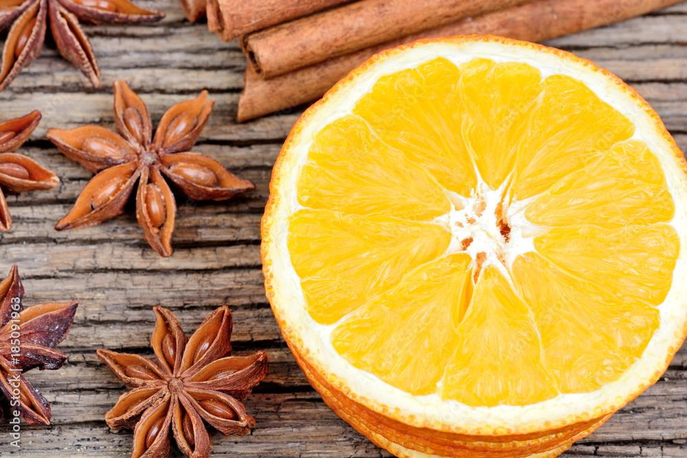 Sliced od dried orange with cinnamon sticks and star anise Sliced od dried orange with cinnamon sticks and star anise