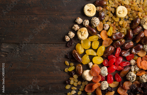 Dried fruits on wooden background