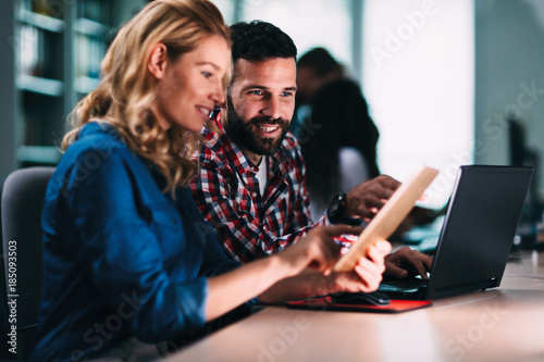 Portrait of software engineers using digital tablet