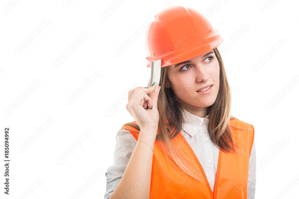 Pensive pretty female constructor with credit card Pensive pretty female constructor with credit card