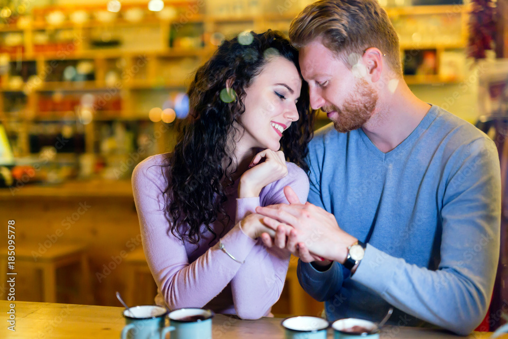 Romantic couple having date in coffee shop