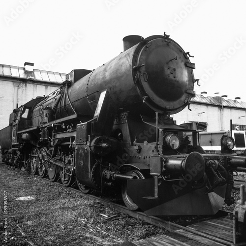 Old steamer in a railway depot photo