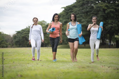 A group of girls are having fun after yoga.