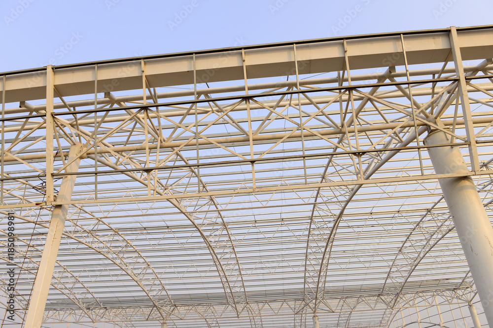 Fototapeta premium Steel structure workshop roof is under construction