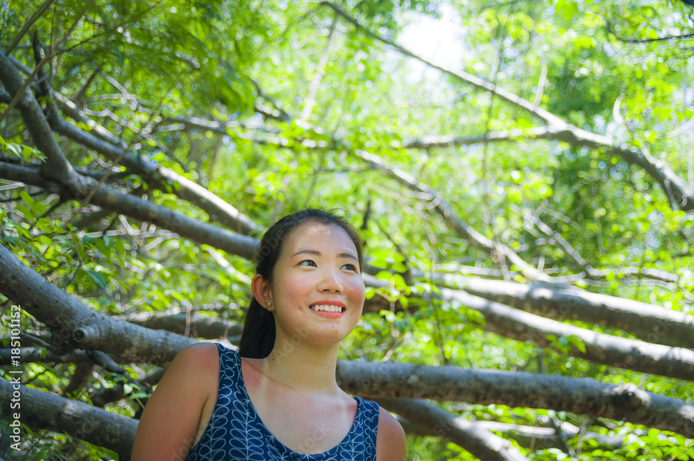 young pretty and happy Asian Chinese woman taking a walk excursion trip on tropical mountain enjoying nature smiling cheerful in holiday young pretty and happy Asian Chinese woman taking a walk excursion trip on tropical mountain enjoying nature smiling cheerful in holiday