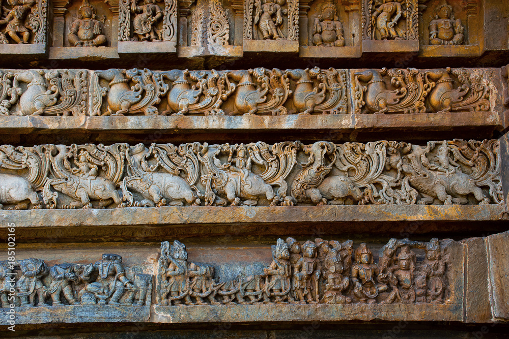 Reliefs on the outer wall of the Hoysaleswara Temple, Hoysala style, Halebidu, Karnataka.