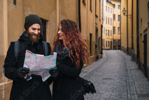 Couple with map on street