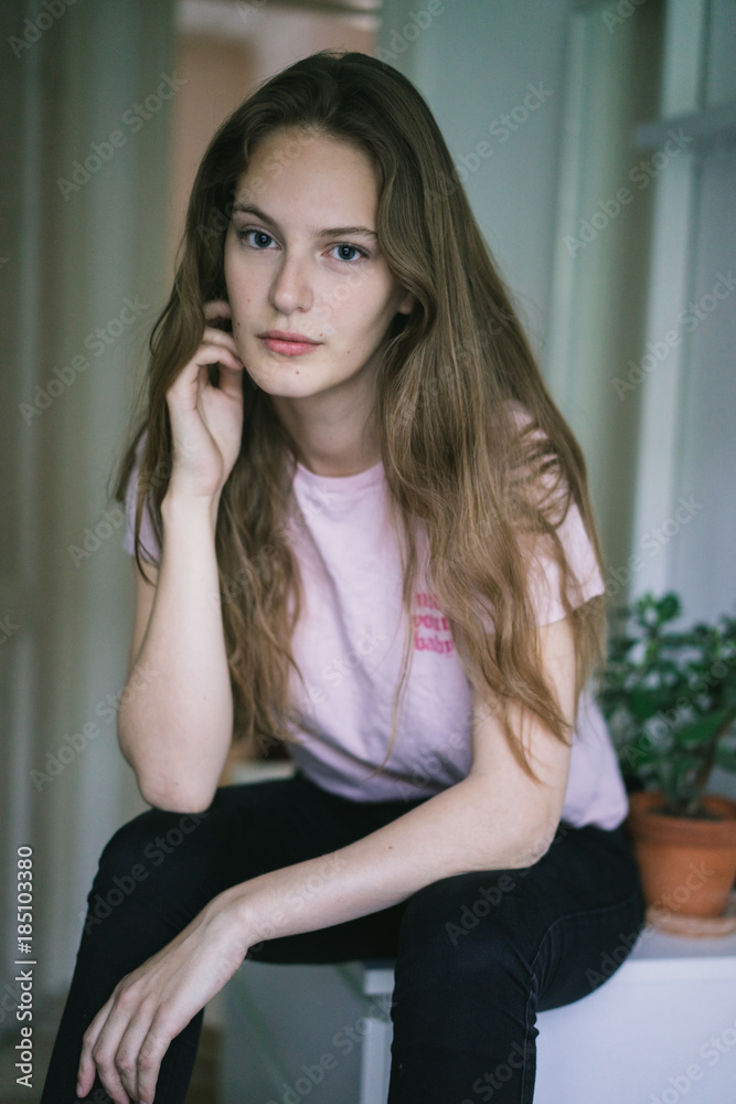 Young woman sitting at home Young woman sitting at home