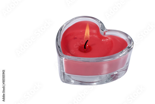 Heart shaped wax candle on white background