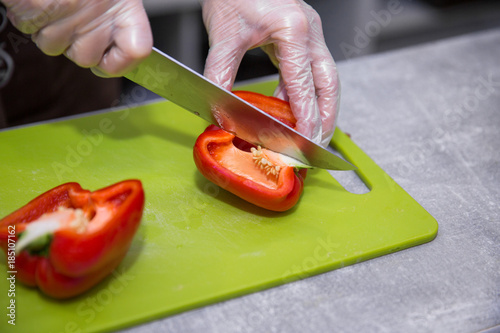 Salad preparation - cutting red pepper into pieces