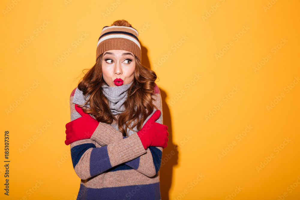 Portrait of a pretty frozen girl dressed in winter clothes Portrait of a pretty frozen girl dressed in winter clothes