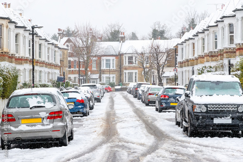 Terraced street covered with snow around West Hampstead area in London