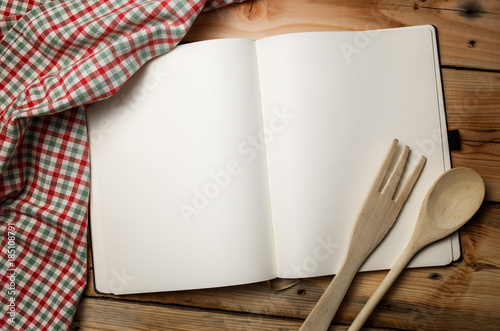 Obraz na plátne Blank recipe book on wooden table.