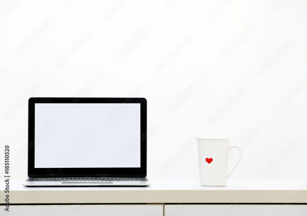 Laptop computer screen and cup of coffee in modern office.copy space. Laptop computer screen and cup of coffee in modern office.copy space.