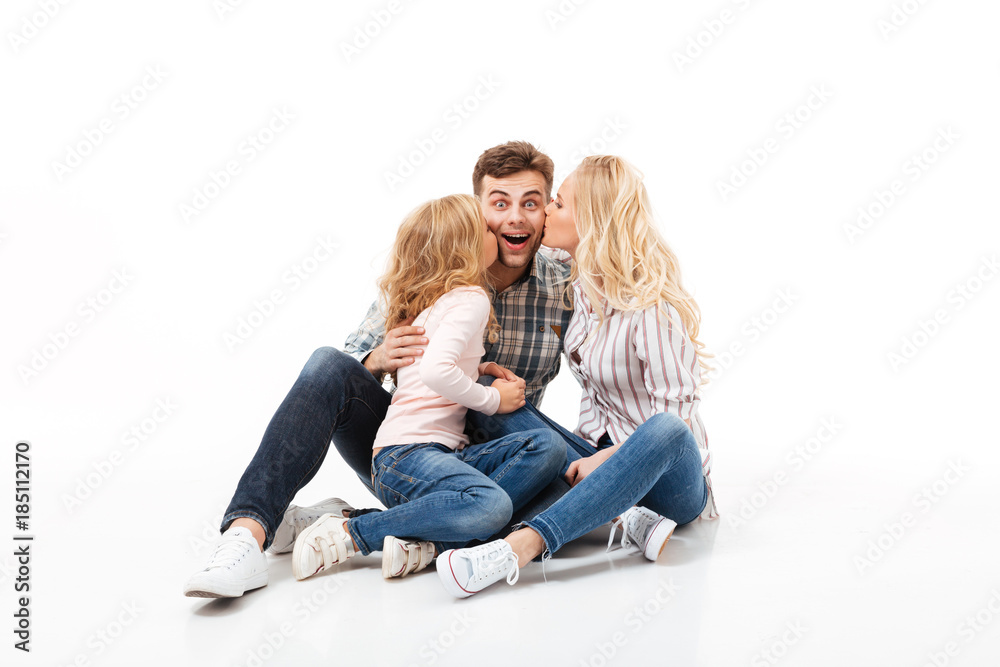 Portrait of a happy family sitting together Portrait of a happy family sitting together