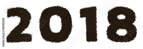 Numeral 2018 text made of ground coarse coffee isolated on white. Flat lay, top view