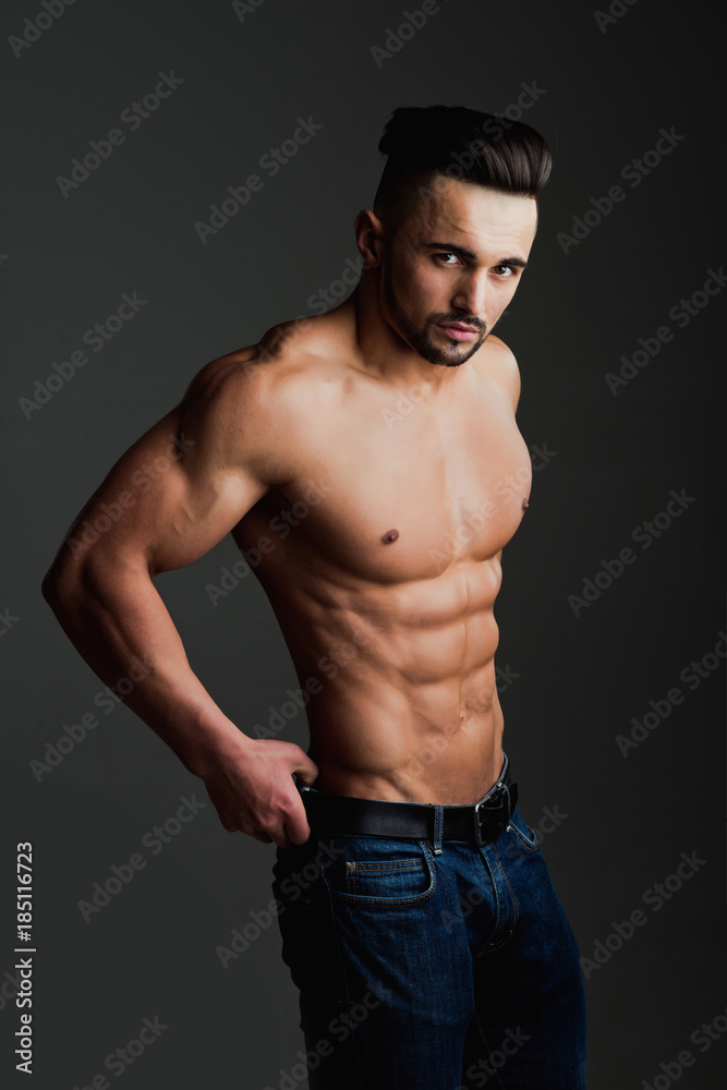 Fototapeta premium Man with muscular body and bare chest or coach sportsman