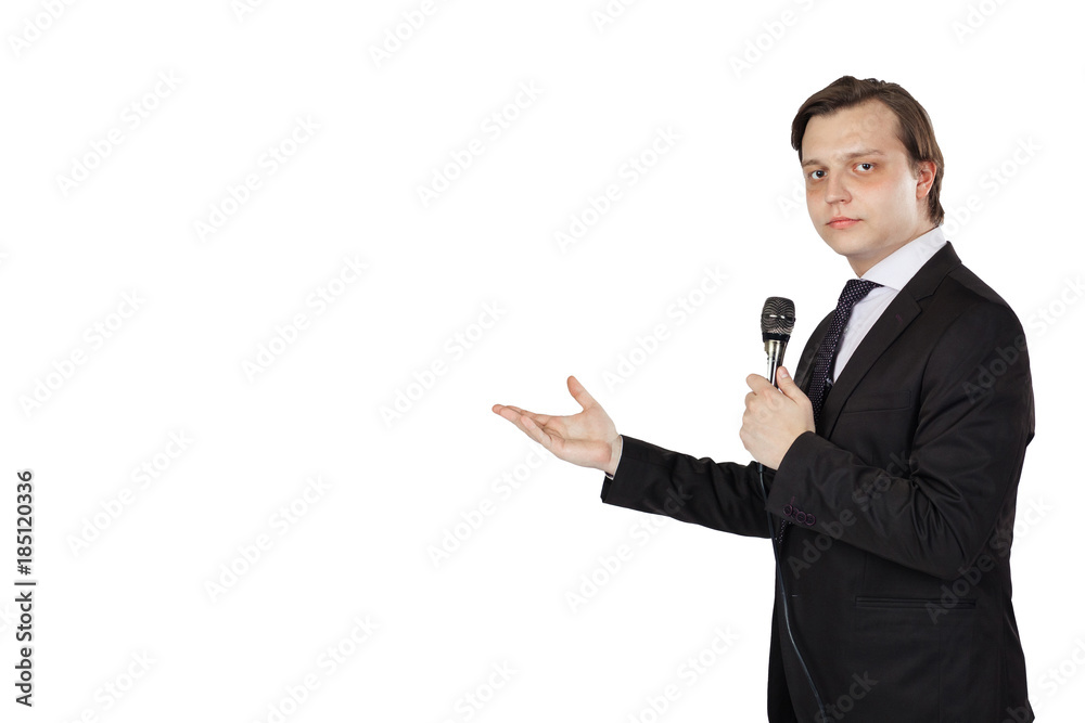 Young elegant talking man holding microphone talking with pointing finger. Young elegant talking man holding microphone talking with pointing finger.
