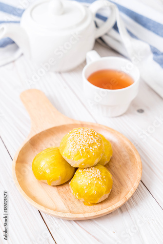 Chinese pastry or moon cake filled with mung bean paste and salted egg yolk