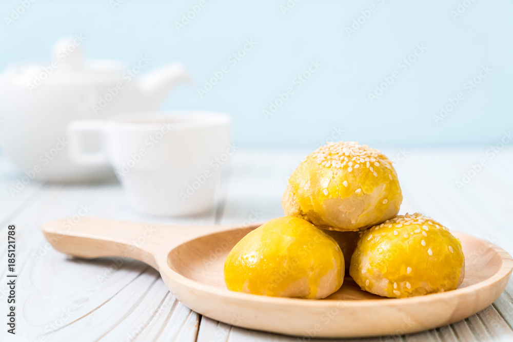 Chinese pastry or moon cake filled with mung bean paste and salted egg yolk