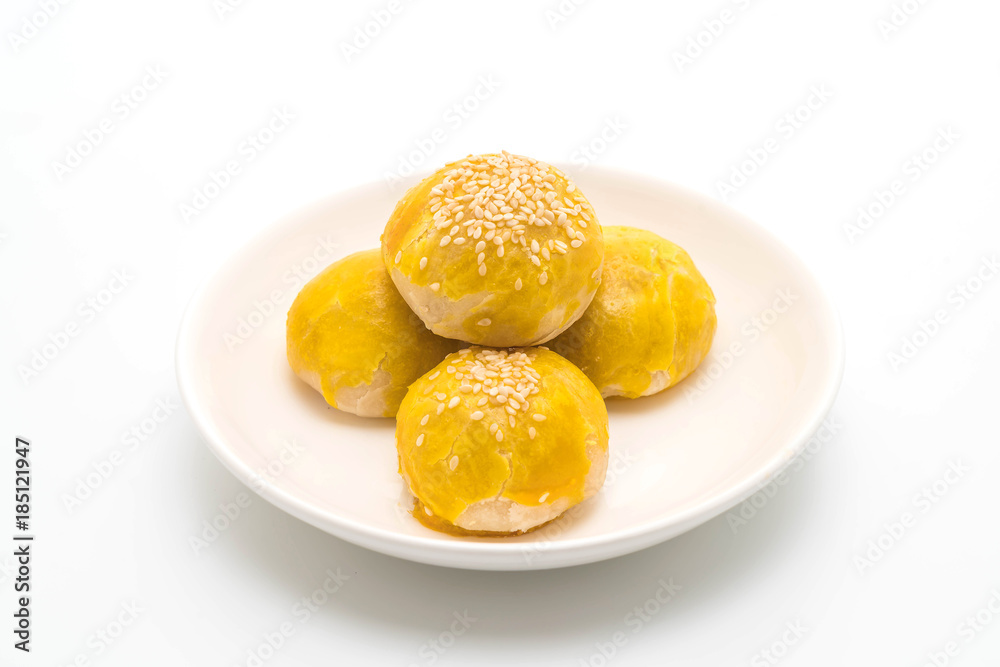 Chinese pastry or moon cake filled with mung bean paste and salted egg yolk Chinese pastry or moon cake filled with mung bean paste and salted egg yolk