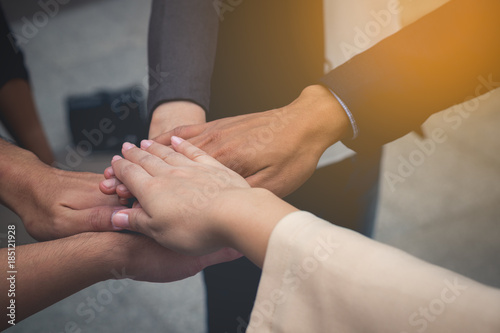 business team work concept : business people hold hand together ,professional agreement partnership community