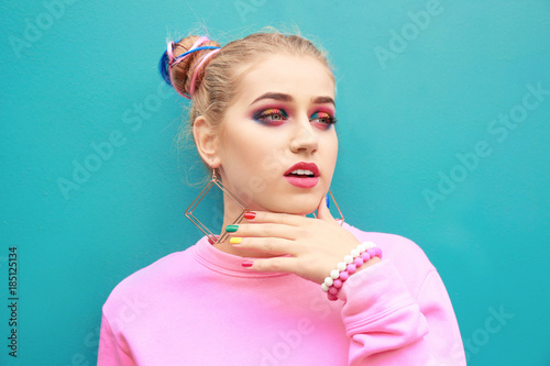 Young woman with rainbow ma...