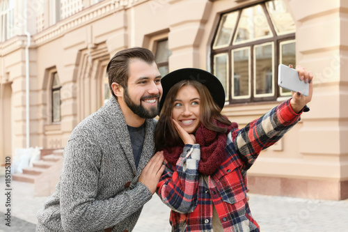 Young adorable couple takin...