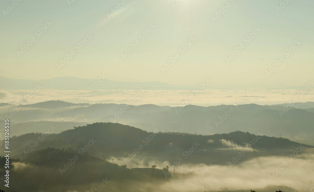 Landscape of mountain with the clouds and fog, Top view of the haze on the mountain, The foggy morning at the mountain.