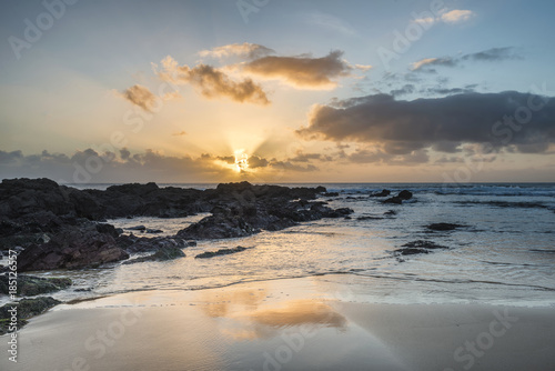 Stunning sunset landscape image of Freshwater West beach on Pembrokeshire Coast in Wales