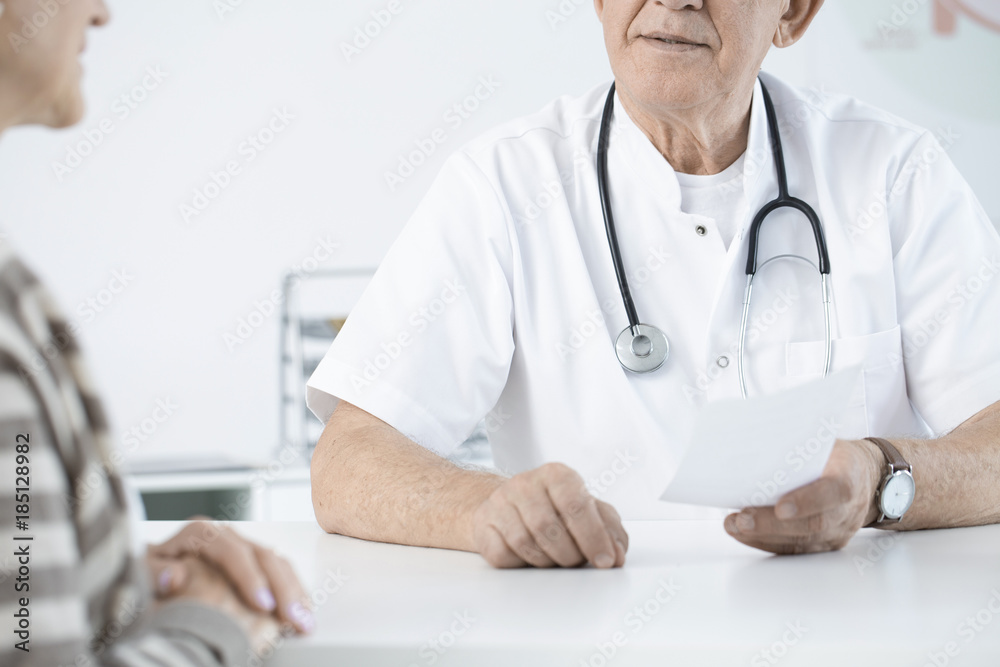 Doctor with stethoscope giving prescription Doctor with stethoscope giving prescription