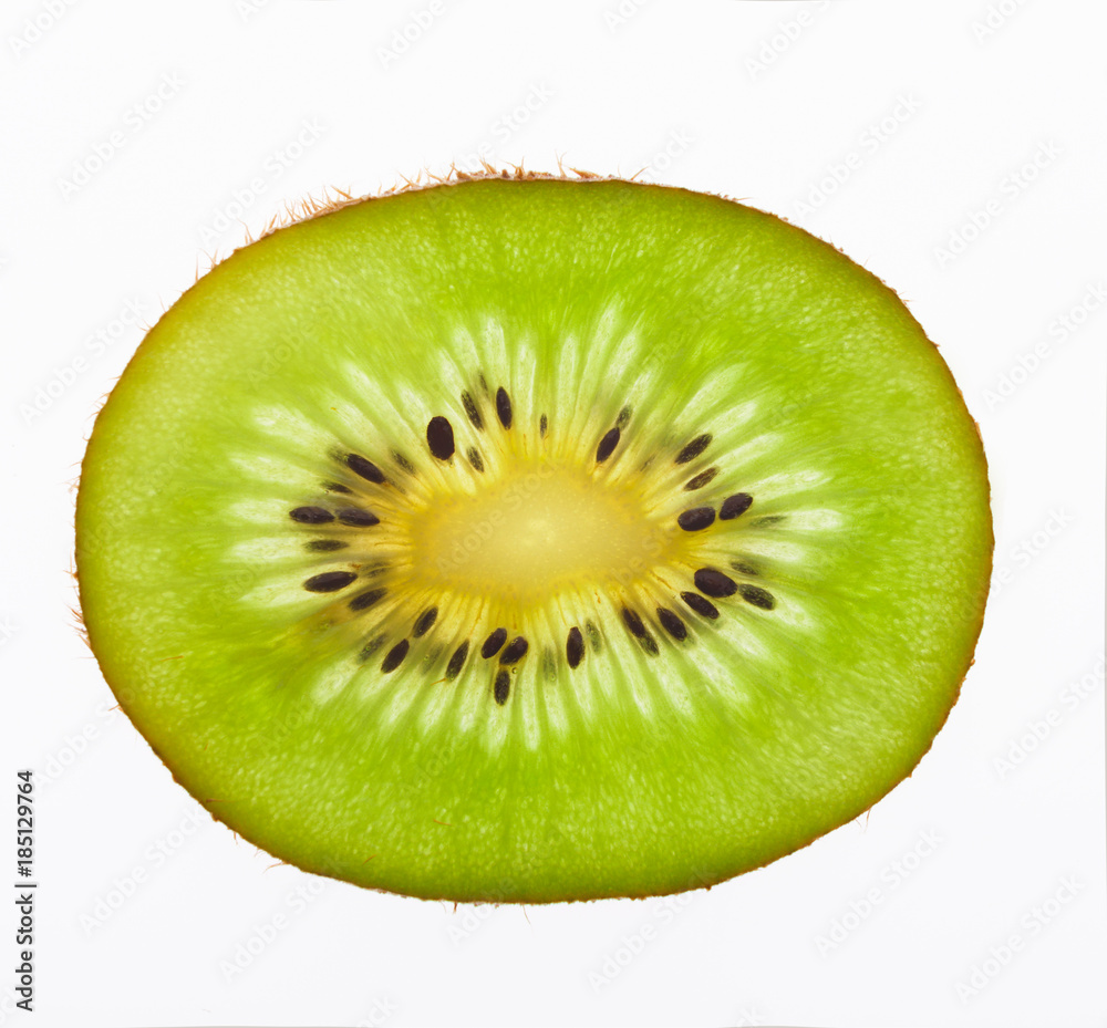 Green kiwi slice backlit, isolated on white Green kiwi slice backlit, isolated on white
