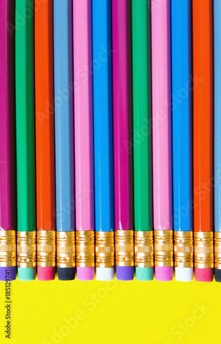 Multicolored stripes of colored pencils close-up.