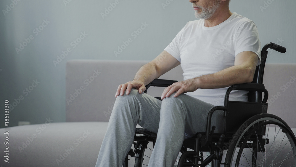 Φωτογραφία Injured man in wheelchair at rehabilitation center, hopes to walk again, closeup